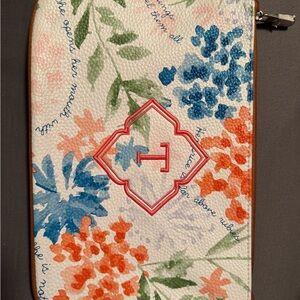 Floral Patterned leather wristlet  with coral monogram “T”